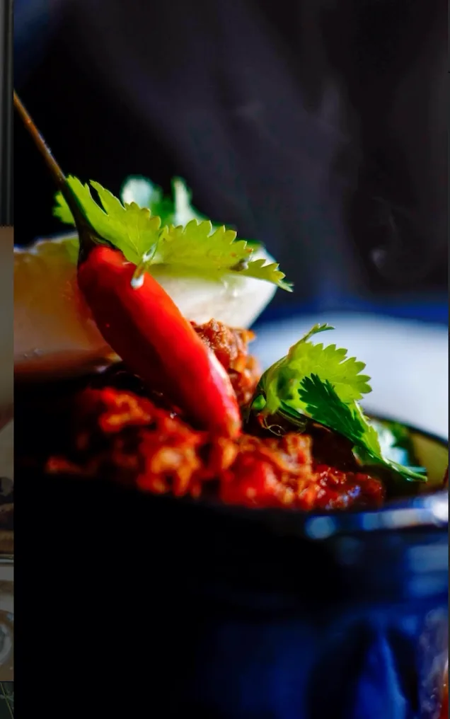 A richly spiced dish finished with chilli and fresh herbs at Guys Bar