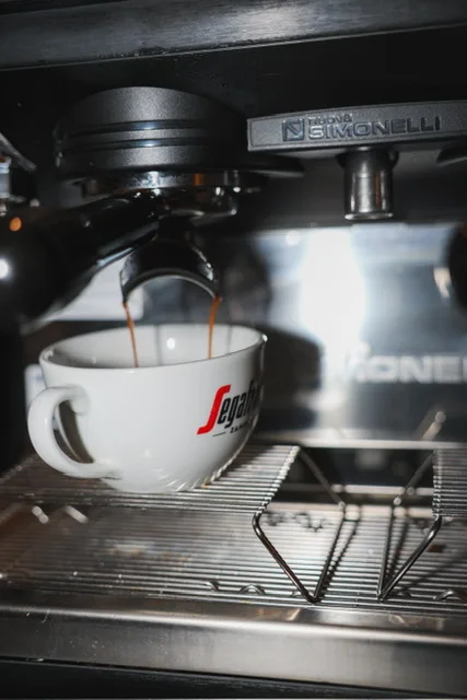 Espresso pouring from the coffee machine at Guys Bar