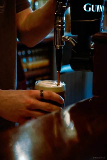 A pint being poured at the Guinness tap in Guys Bar