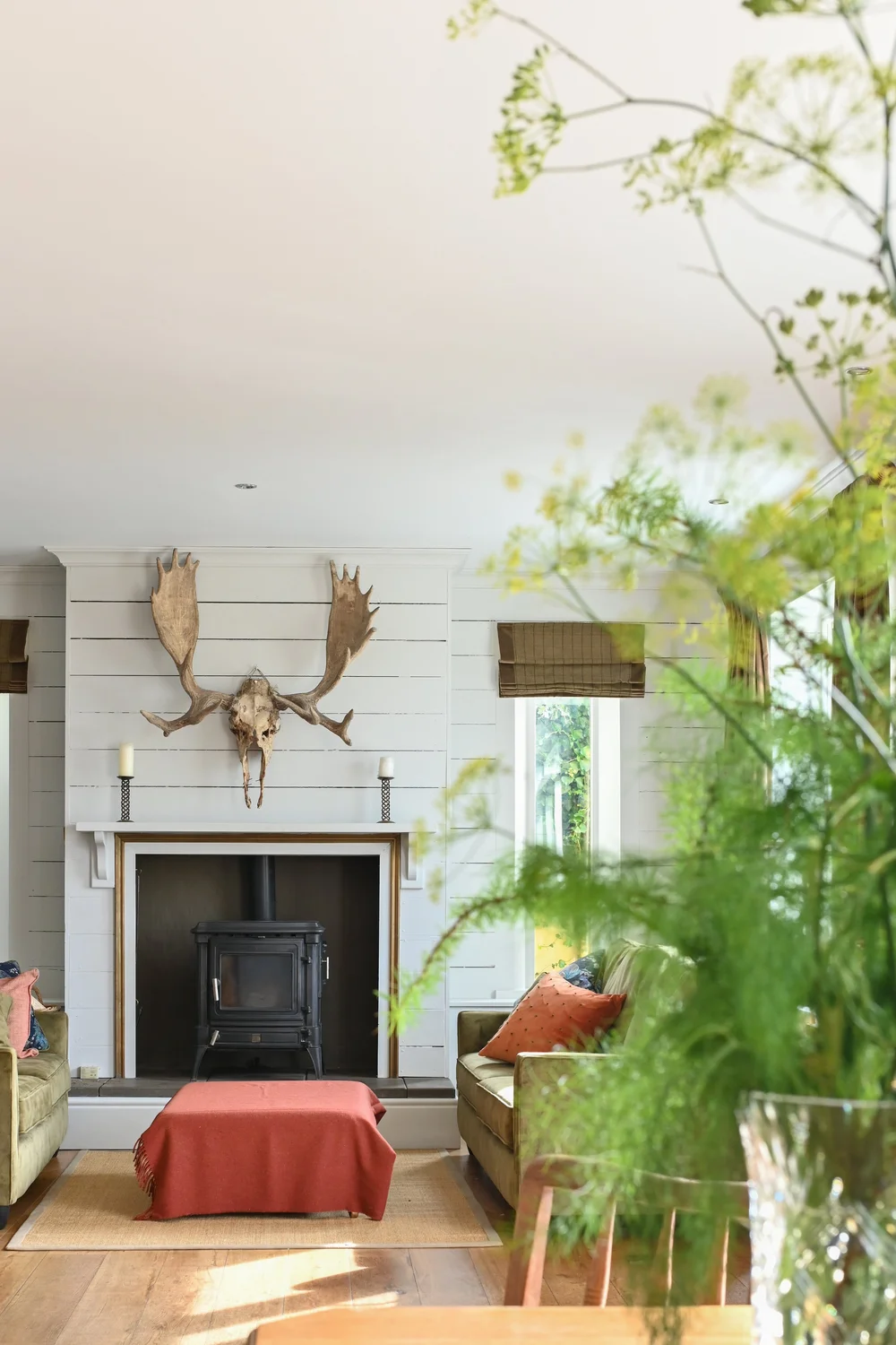 The Lodge sitting room with fireplace and warm interiors